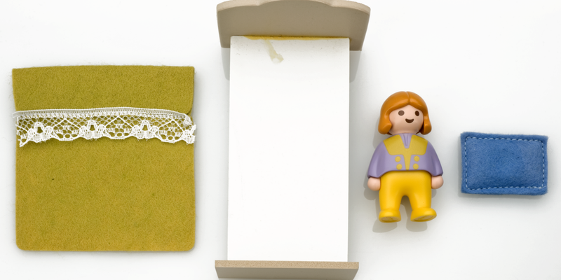 Doll-sized bedroom furniture.