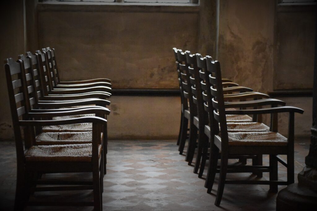 Empty Brown Wooden Armchairs.